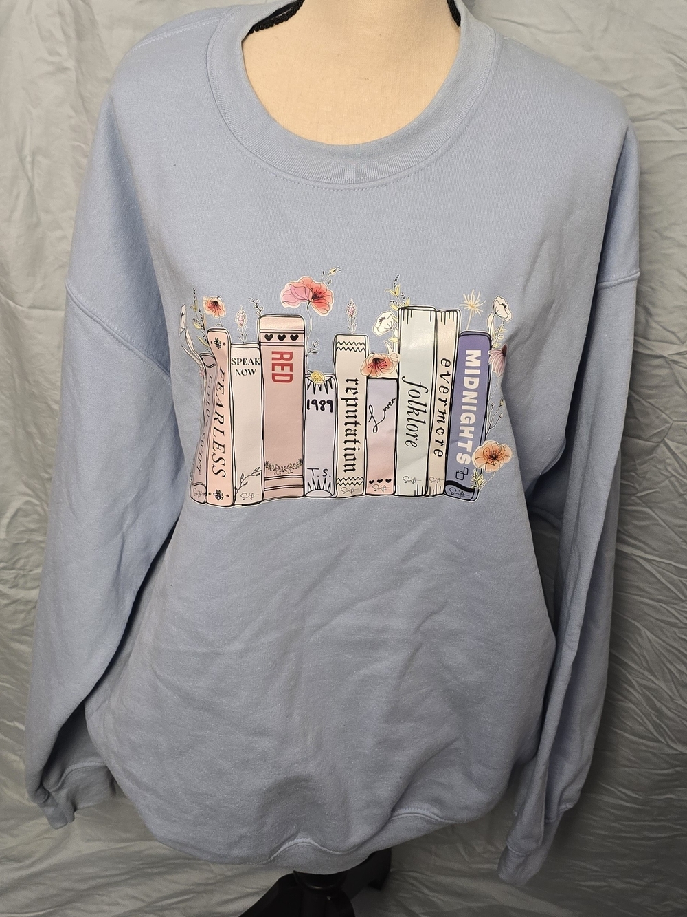 Gildan Light Blue Crewneck Sweatshirt with Taylor Swift Book-Spine Graphic